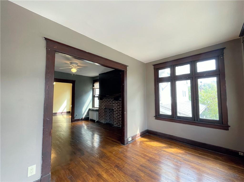 600 Ardmore Boulevard, Unit 2 Pittsburgh, PA 15221 - Photo 2 of 6 wooden floor in an empty room with a window