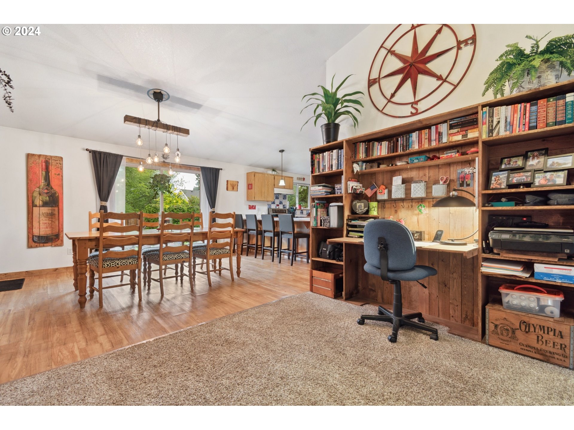890 1st Falls View Road Stevenson, WA 98648 - Photo 11 of 43 a dining room with furniture and a book shelf