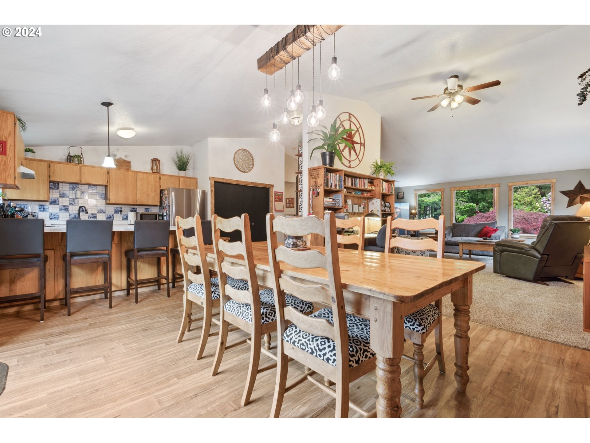890 1st Falls View Road Stevenson, WA 98648 - Photo 12 of 43 a living room with lots of furniture and a chandelier