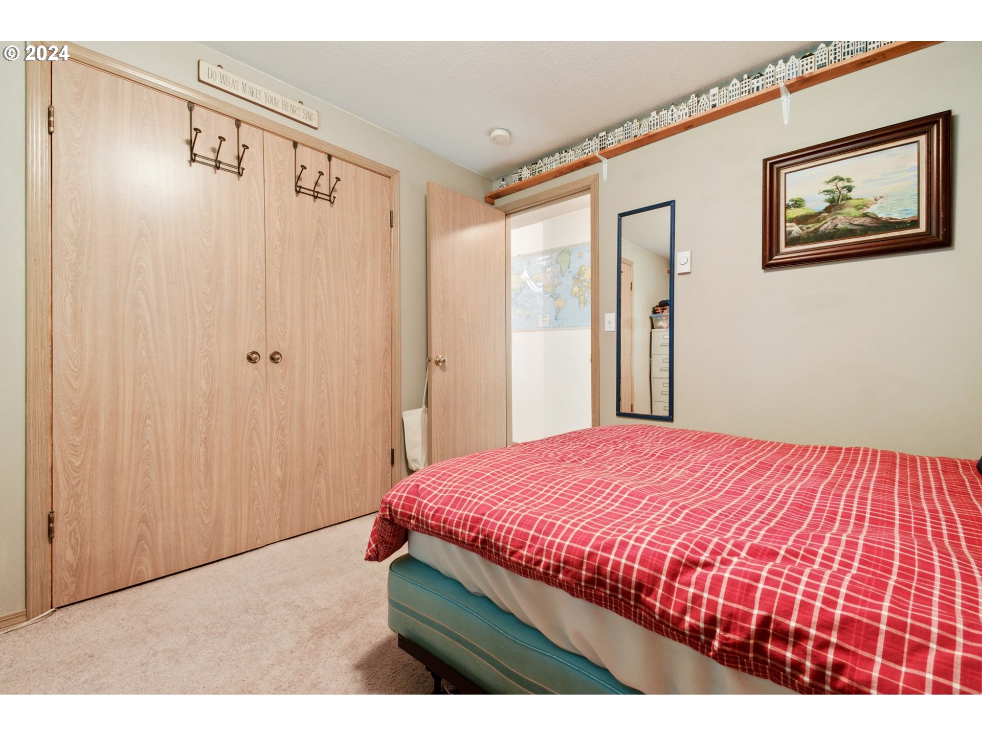 890 1st Falls View Road Stevenson, WA 98648 - Photo 22 of 43 a bedroom with a bed and a painting on the wall