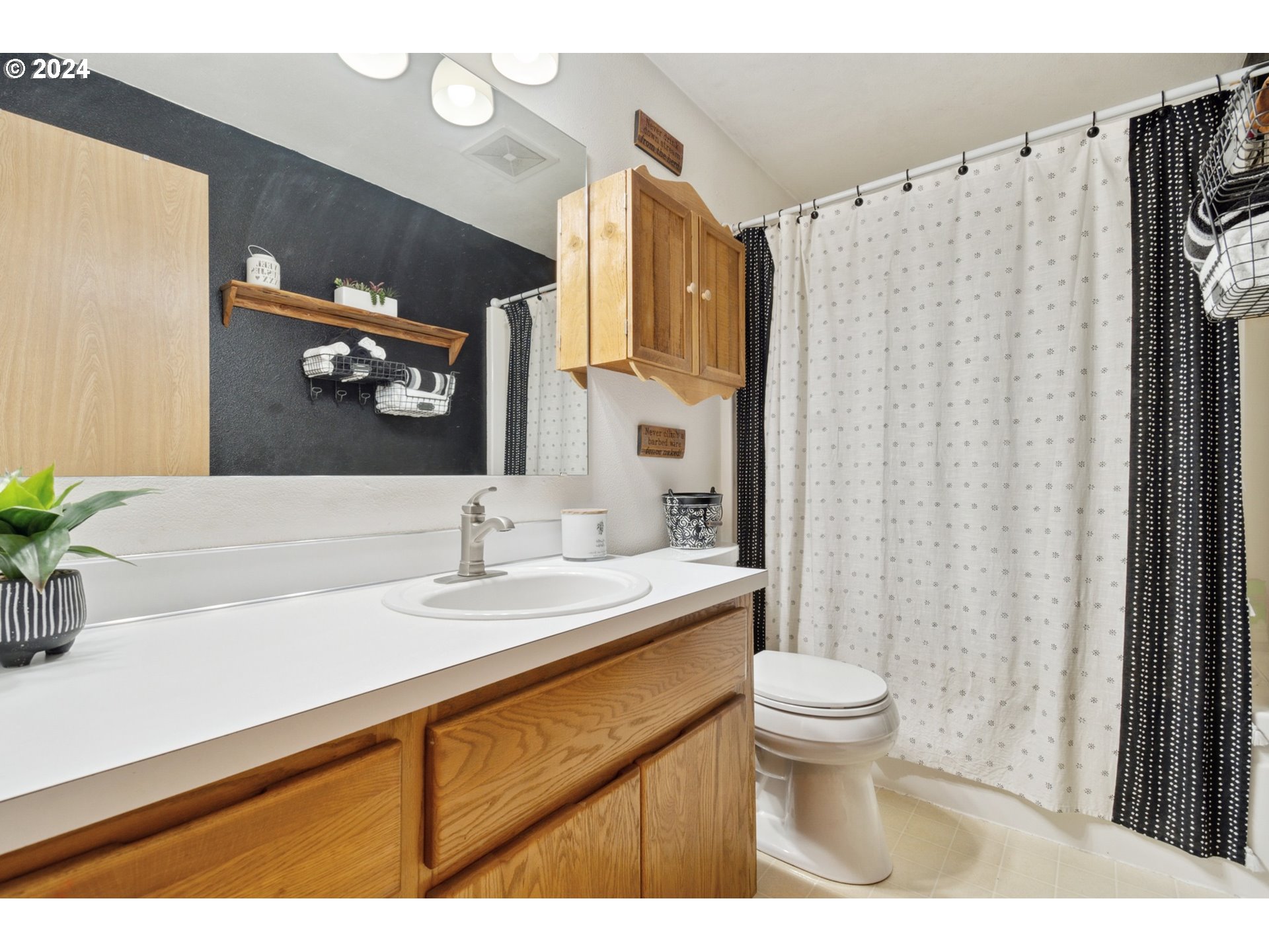 890 1st Falls View Road Stevenson, WA 98648 - Photo 25 of 43 a bathroom with a sink a toilet and a mirror