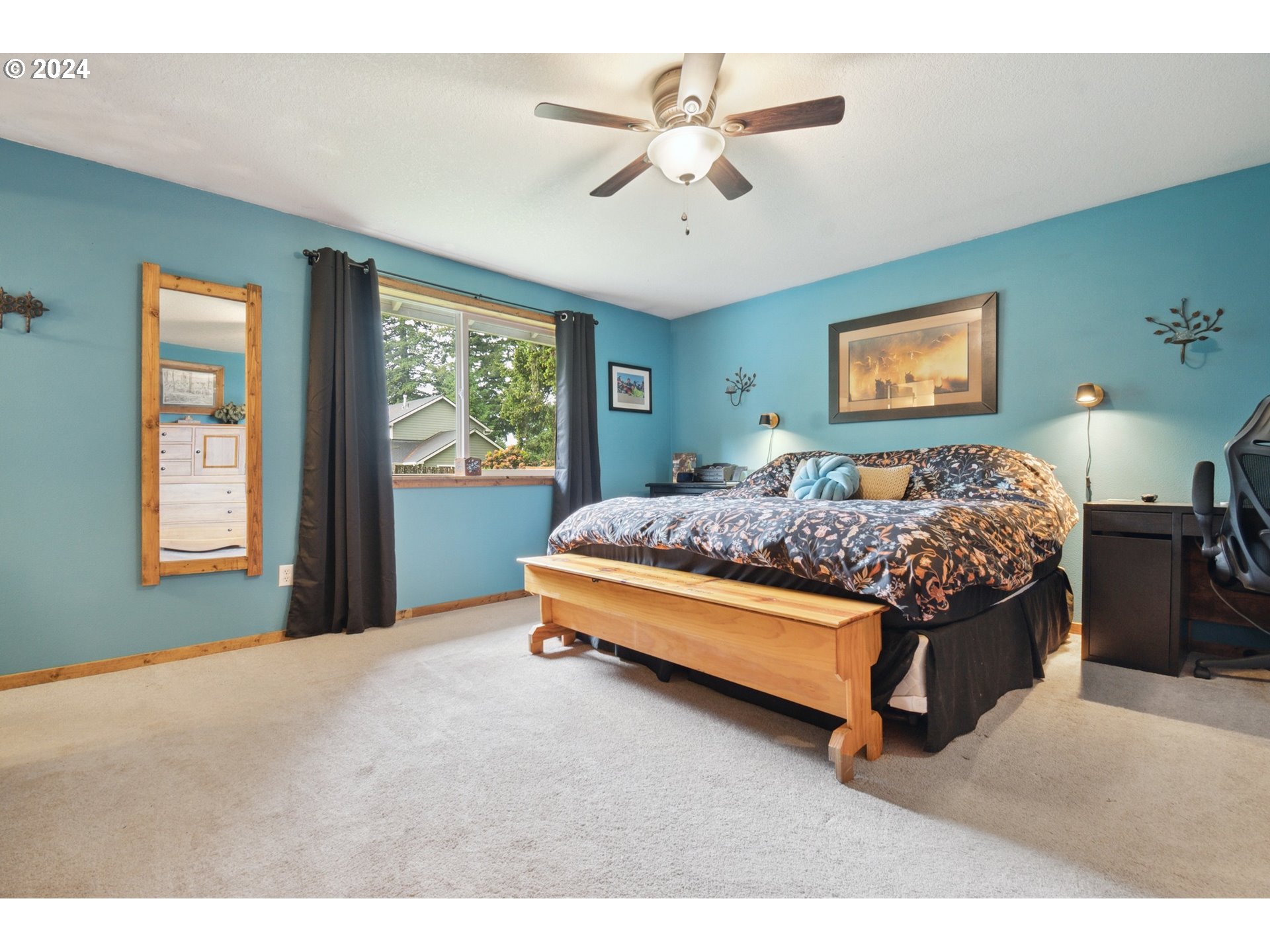 890 1st Falls View Road Stevenson, WA 98648 - Photo 26 of 43 a bedroom with a bed and a chandelier