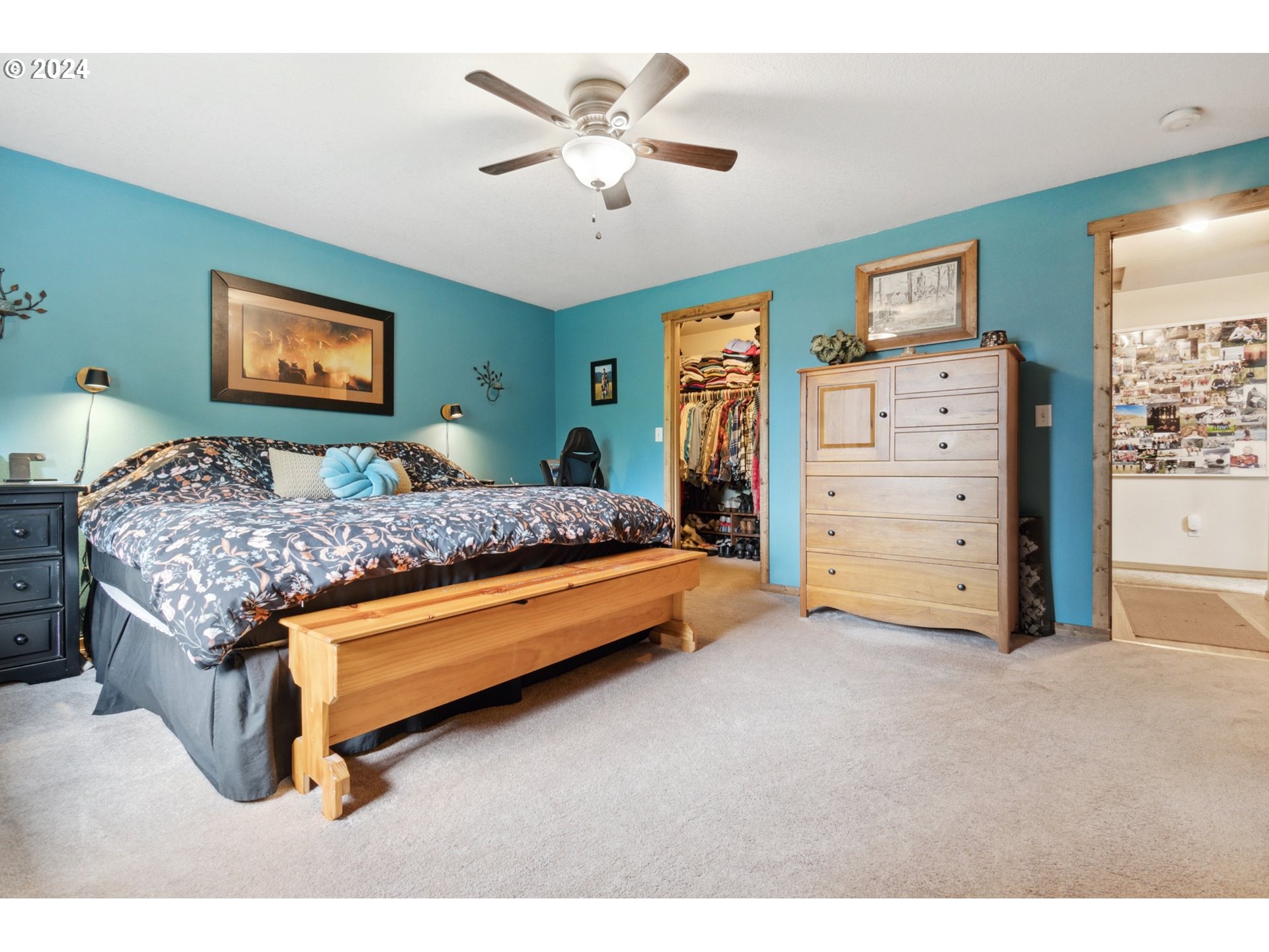 890 1st Falls View Road Stevenson, WA 98648 - Photo 27 of 43 a bedroom with a bed and a chandelier