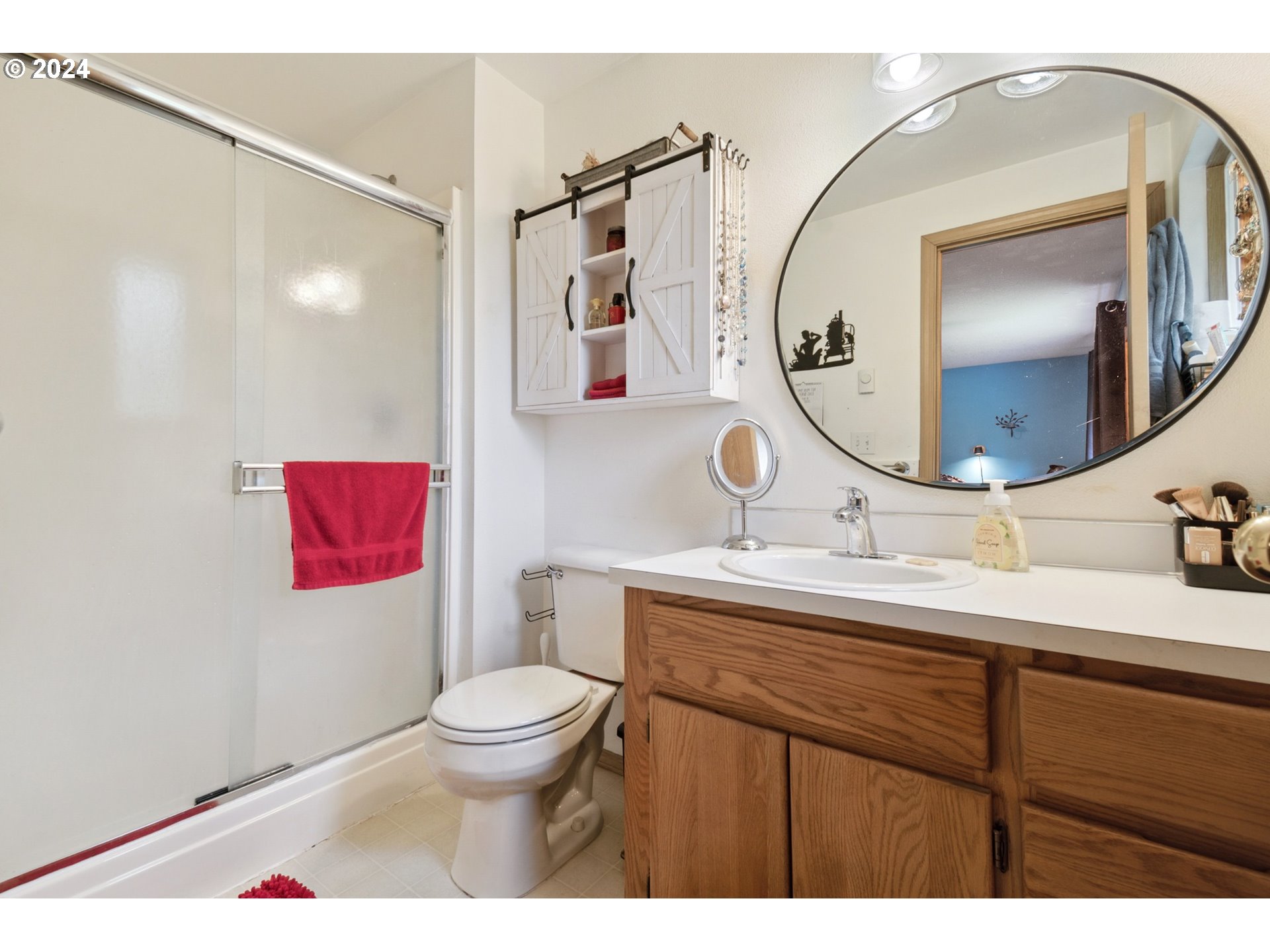890 1st Falls View Road Stevenson, WA 98648 - Photo 28 of 43 a bathroom with a toilet a sink and a mirror