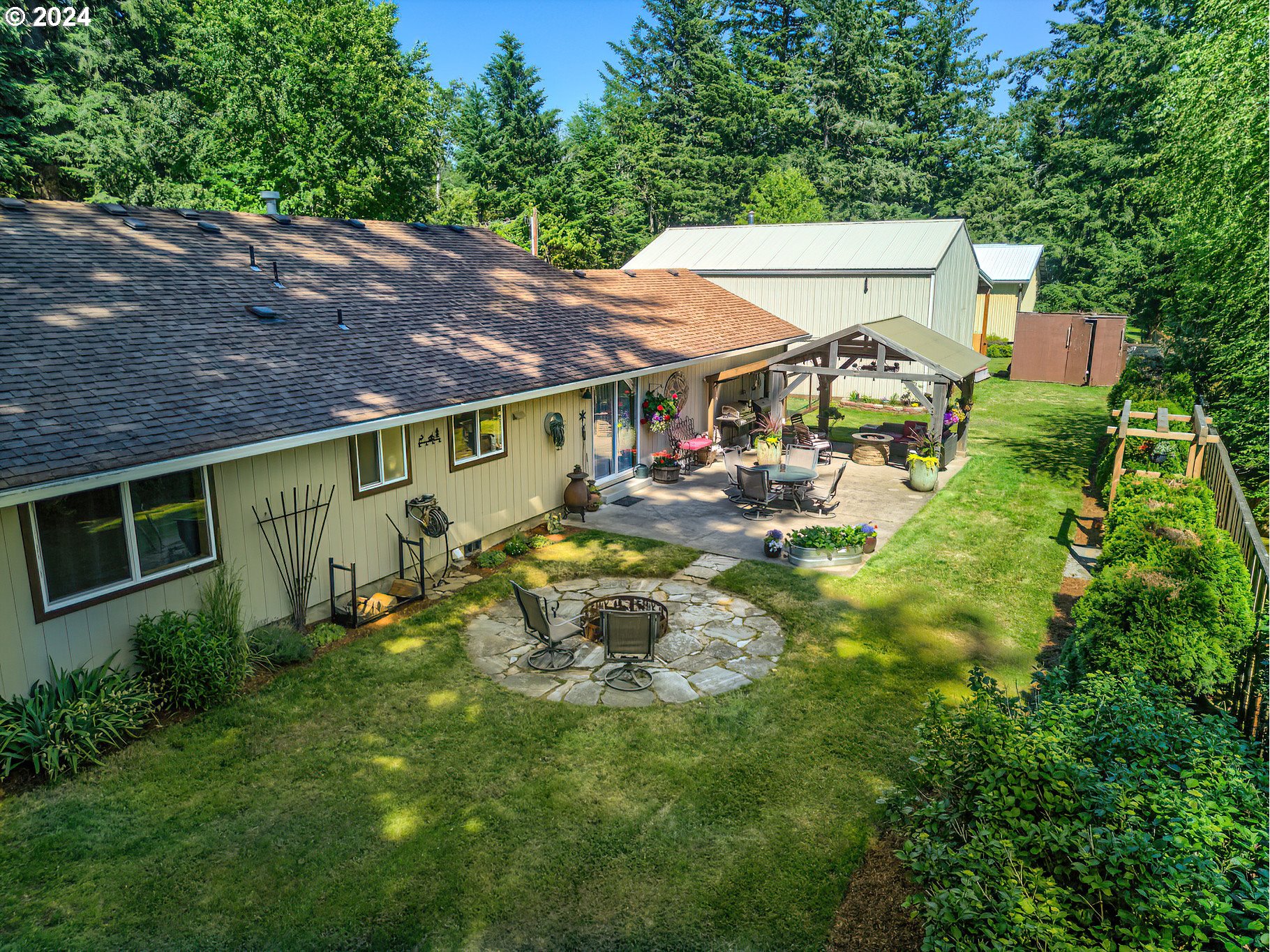 890 1st Falls View Road Stevenson, WA 98648 - Photo 35 of 43 a view of a house with backyard and sitting area