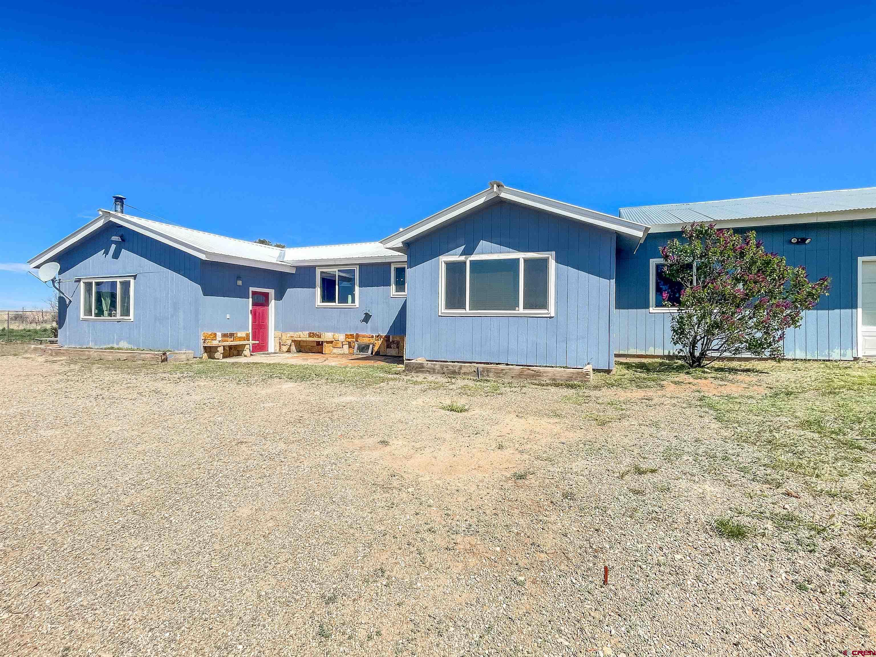 175 County Road Egnar, CO 81325 - Photo 2 of 30 a front view of house with yard