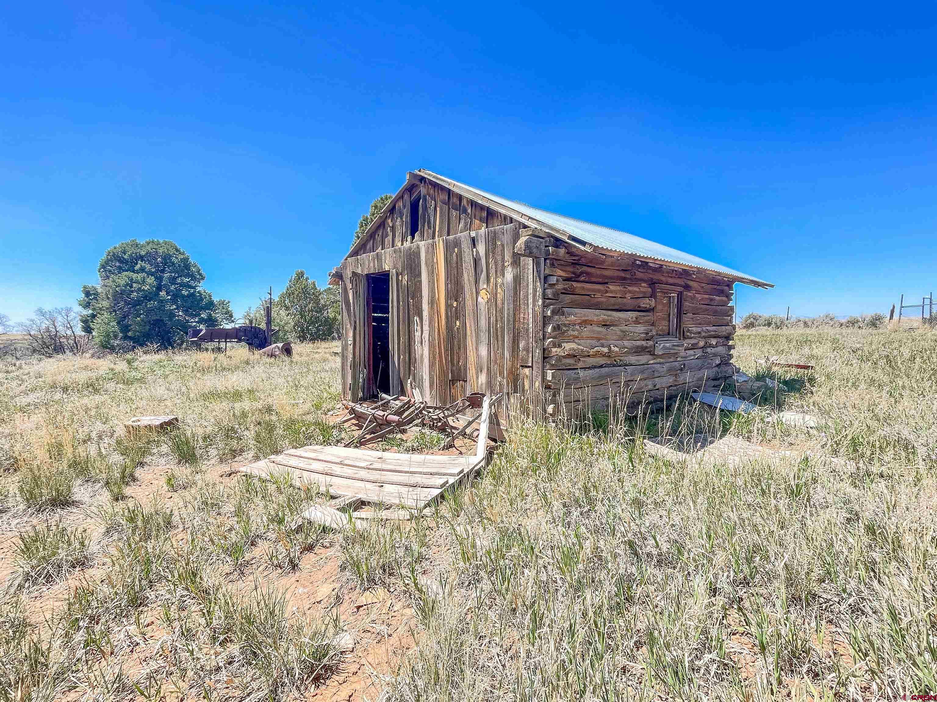 175 County Road Egnar, CO 81325 - Photo 22 of 30 a view of a lake with a house in the background