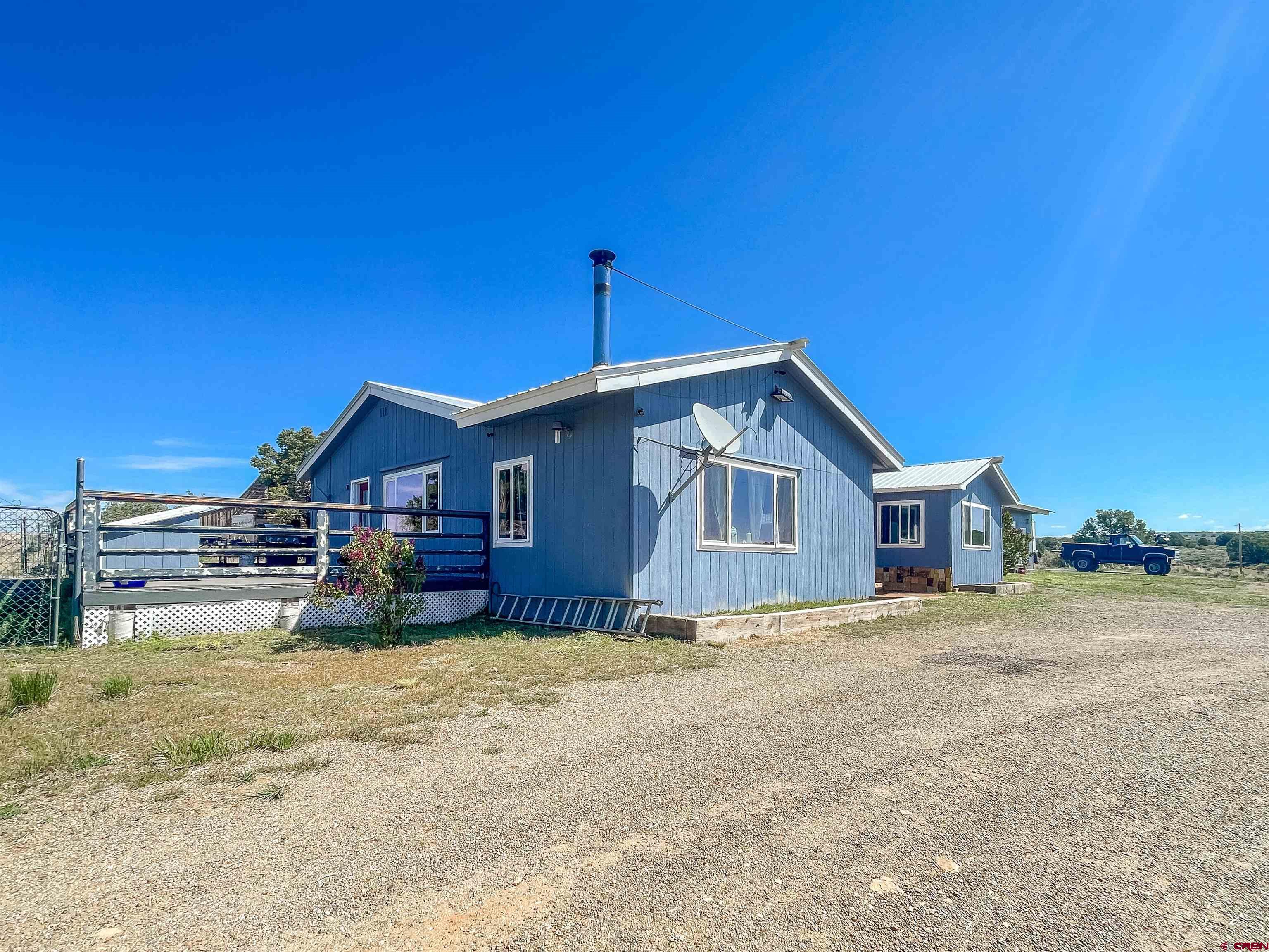 175 County Road Egnar, CO 81325 - Photo 26 of 30 a view of a house with a yard