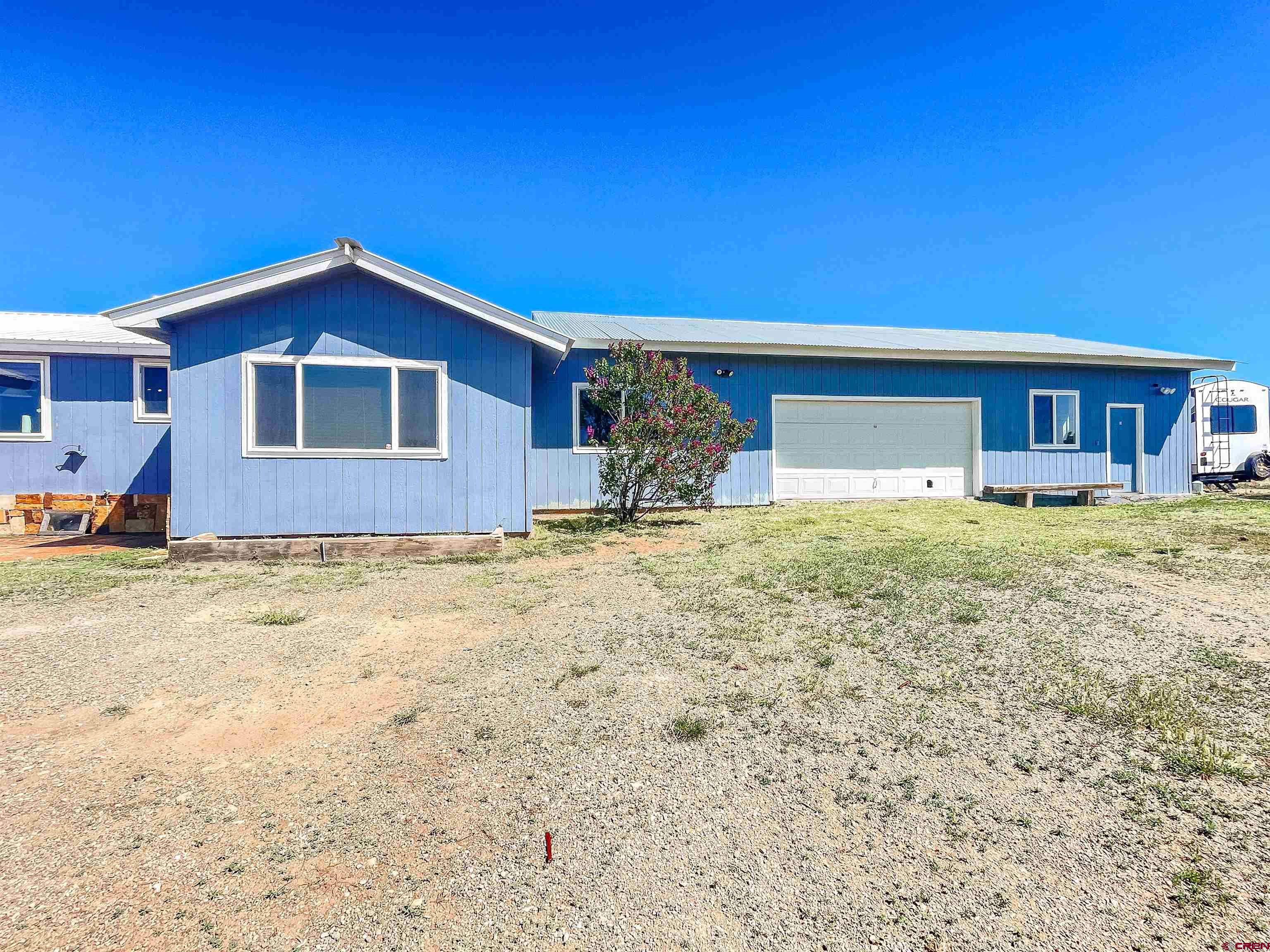 175 County Road Egnar, CO 81325 - Photo 29 of 30 a front view of a house with a yard