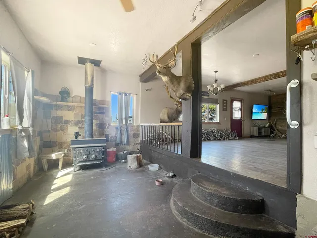 a view of a room wooden floor and windows