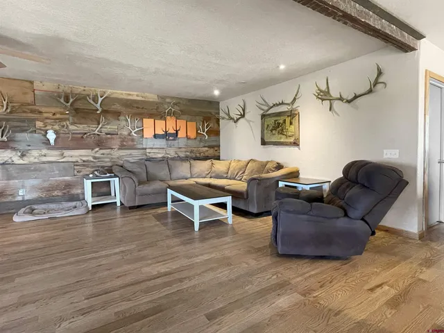 a kitchen with counter top space and wooden floor