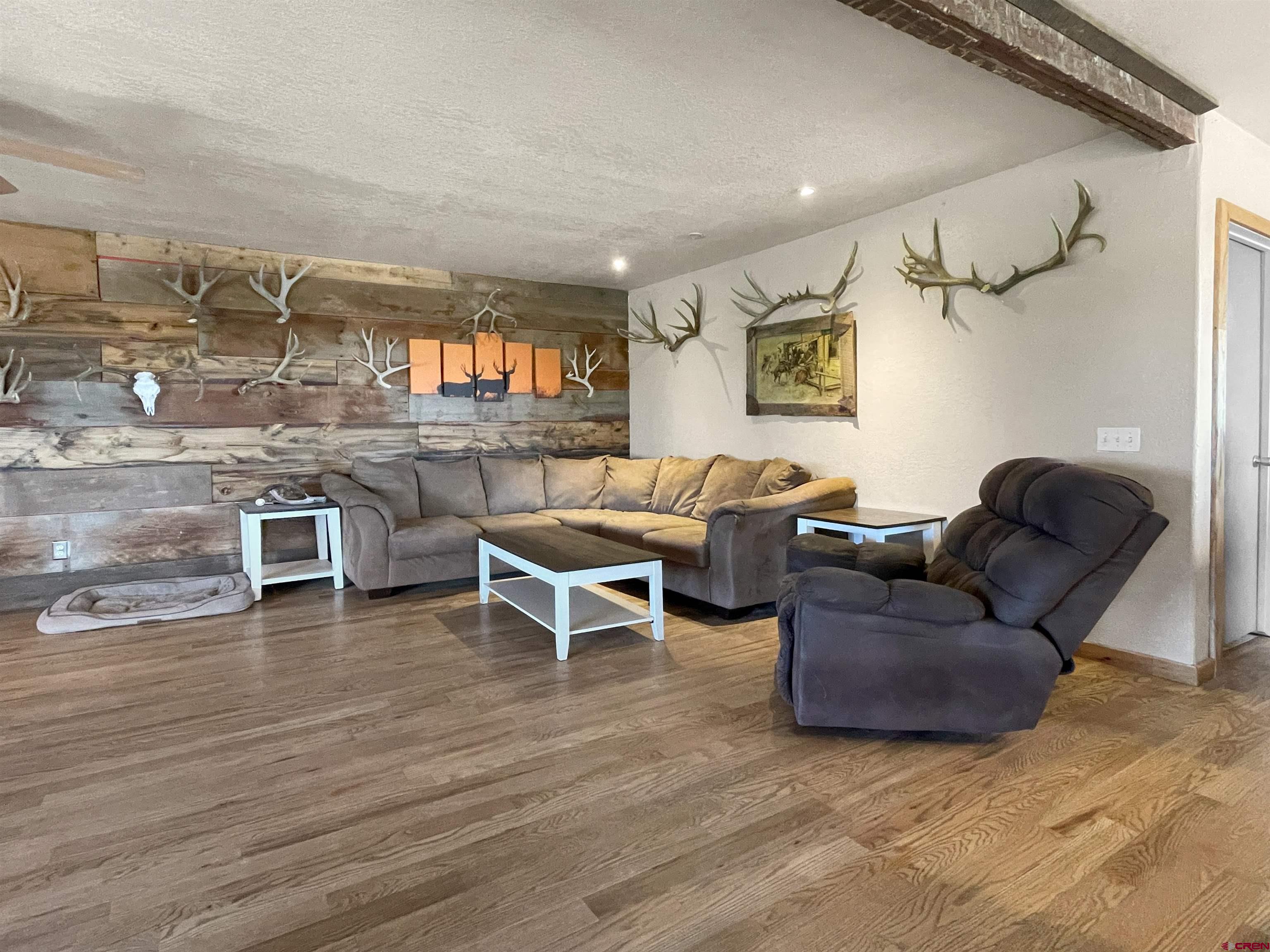 175 County Road Egnar, CO 81325 - Photo 6 of 30 a living room with furniture and a wooden floor