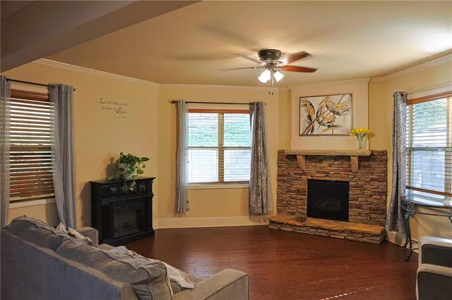 a living room with furniture and a fireplace