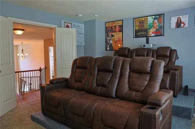 a living room with furniture a couch and a potted plant