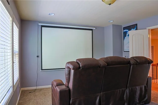 a blue bed sitting in a room next to a window