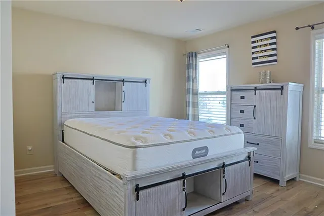 a bedroom with a bed and a dresser