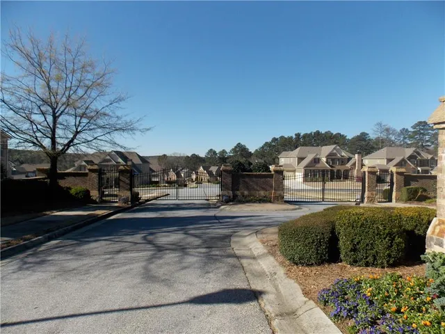 a view of a lake with a yard