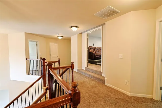 a view of a livingroom with a ceiling fan and window