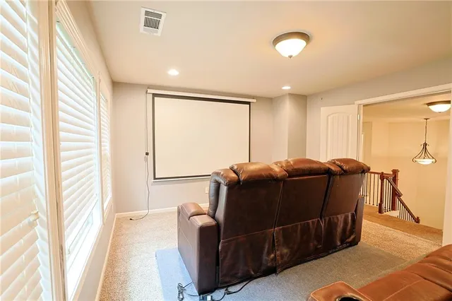 a bathroom with a glass shower door and a mirror