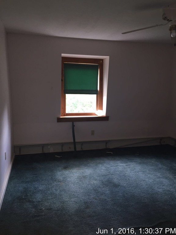 559 Turnpike Road New Ipswich, NH 03071 - Photo 16 of 22 an empty room with a window