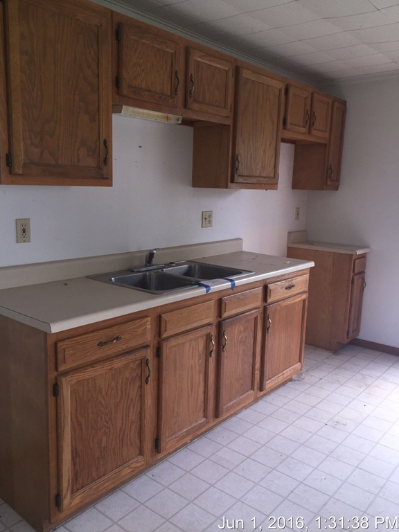 559 Turnpike Road New Ipswich, NH 03071 - Photo 18 of 22 a kitchen with stainless steel appliances granite countertop a sink stove and microwave