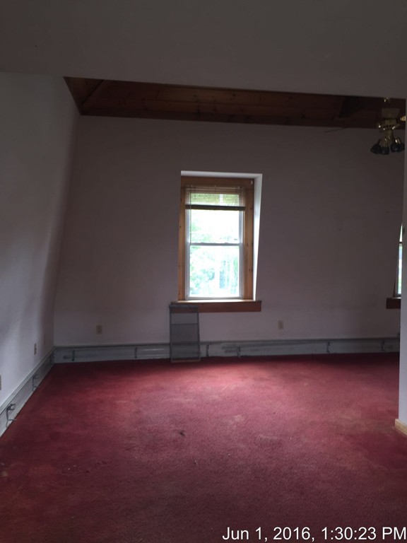 559 Turnpike Road New Ipswich, NH 03071 - Photo 21 of 22 an empty room with a window