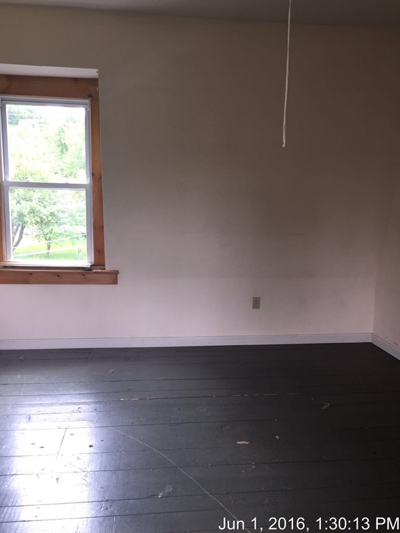559 Turnpike Road New Ipswich, NH 03071 - Photo 22 of 22 a view of a room has wooden floor and a window