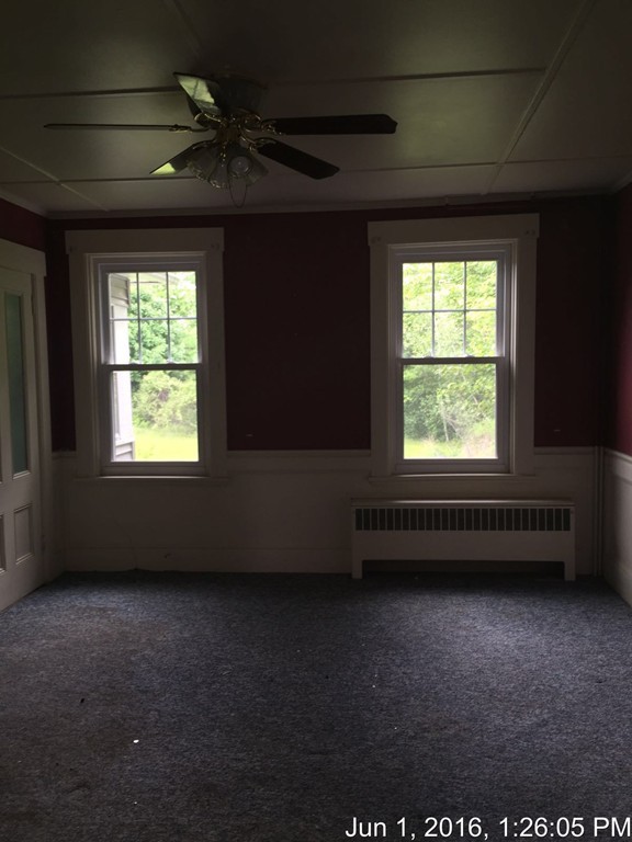 559 Turnpike Road New Ipswich, NH 03071 - Photo 4 of 22 an empty room with a window