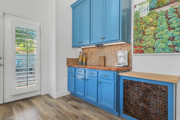 a kitchen with wooden cabinets and a window