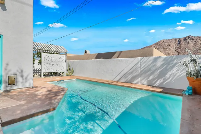 a view of an empty room with a sink and a yard