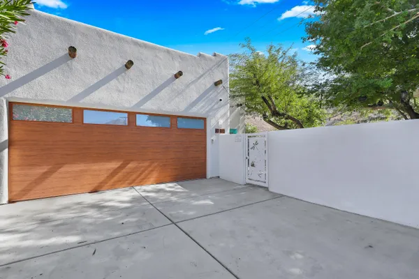 a view of backyard and garage