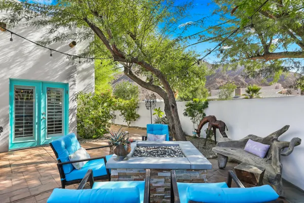 a view of an outdoor sitting area with furniture