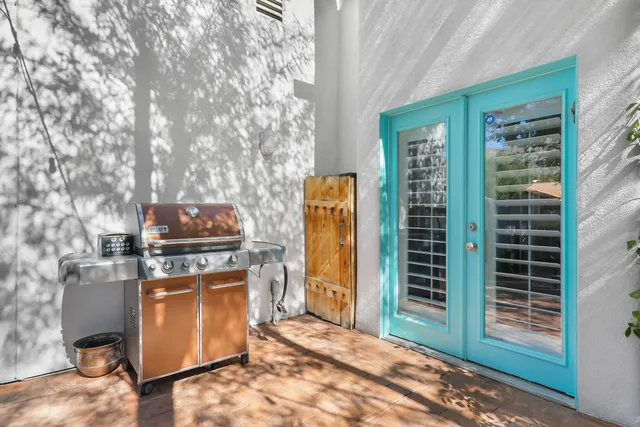 a kitchen with stainless steel appliances a stove top oven
