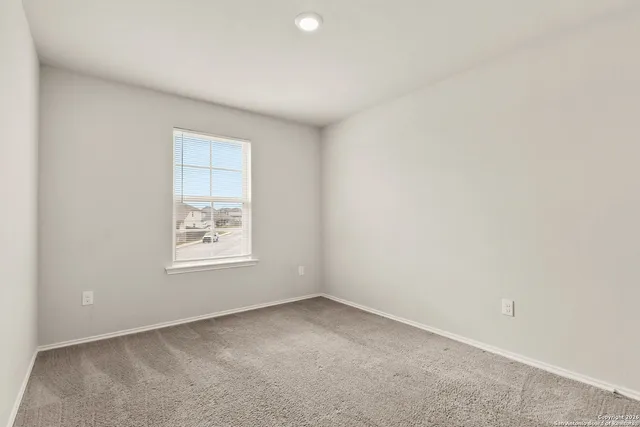 an empty room with closet area and closet