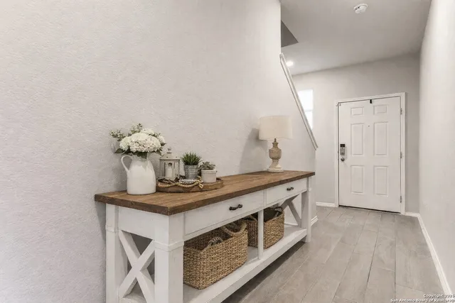a view of kitchen with sink and microwave