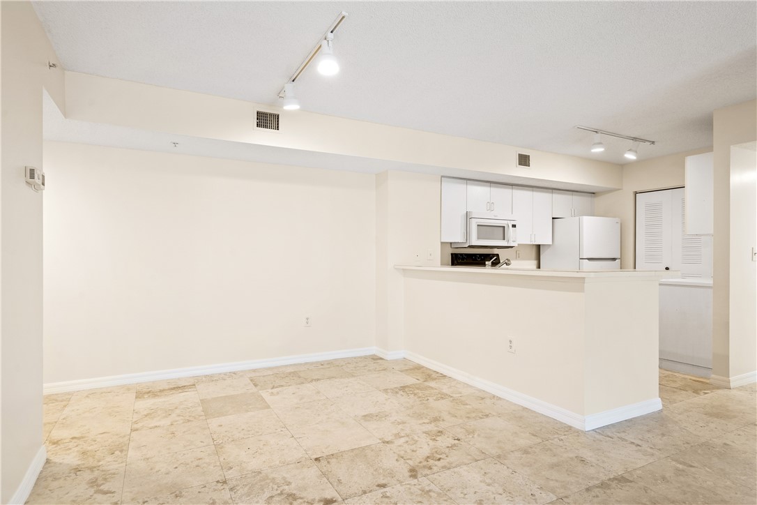 Undisclosed Address Vero Beach, FL 32967 - Photo 11 of 36 a view of kitchen with refrigerator oven