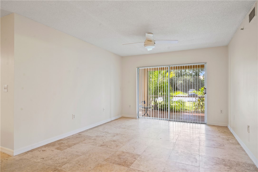Undisclosed Address Vero Beach, FL 32967 - Photo 13 of 36 an empty room with floor to ceiling windows and an outdoor view