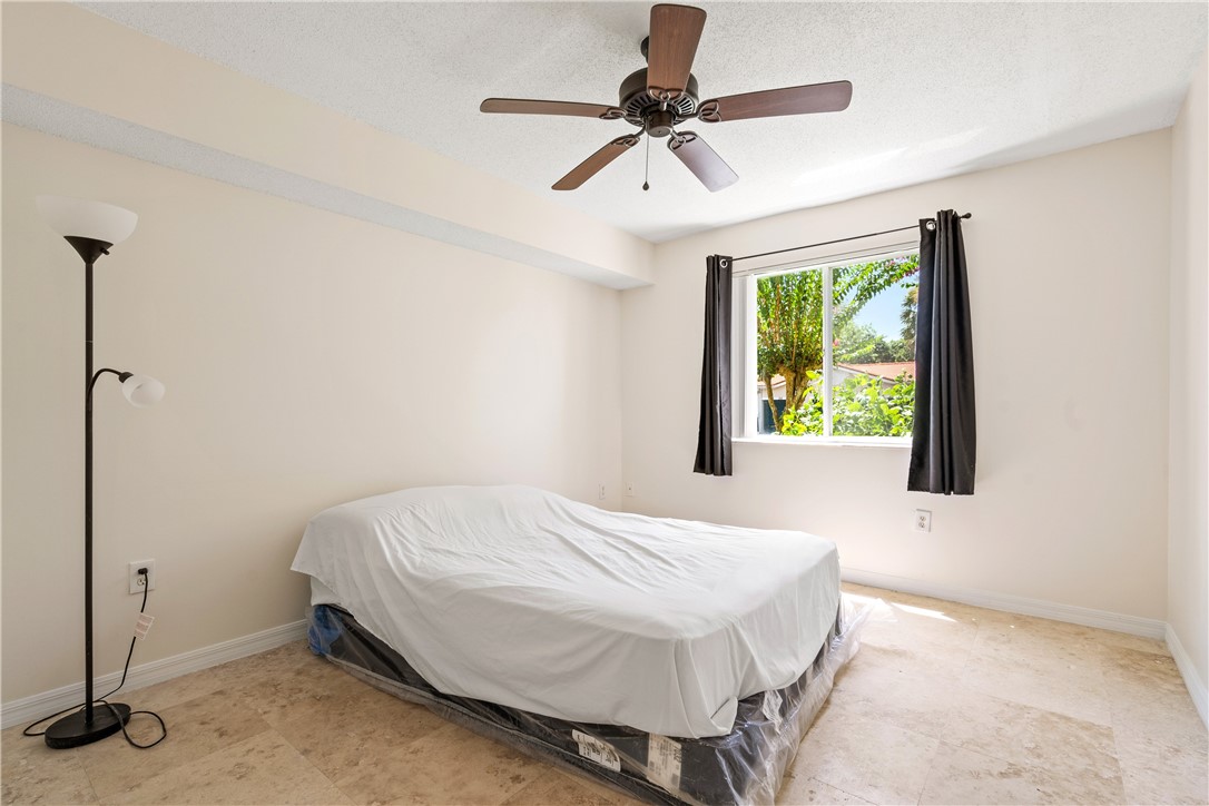 Undisclosed Address Vero Beach, FL 32967 - Photo 24 of 36 a bedroom with a bed and a window