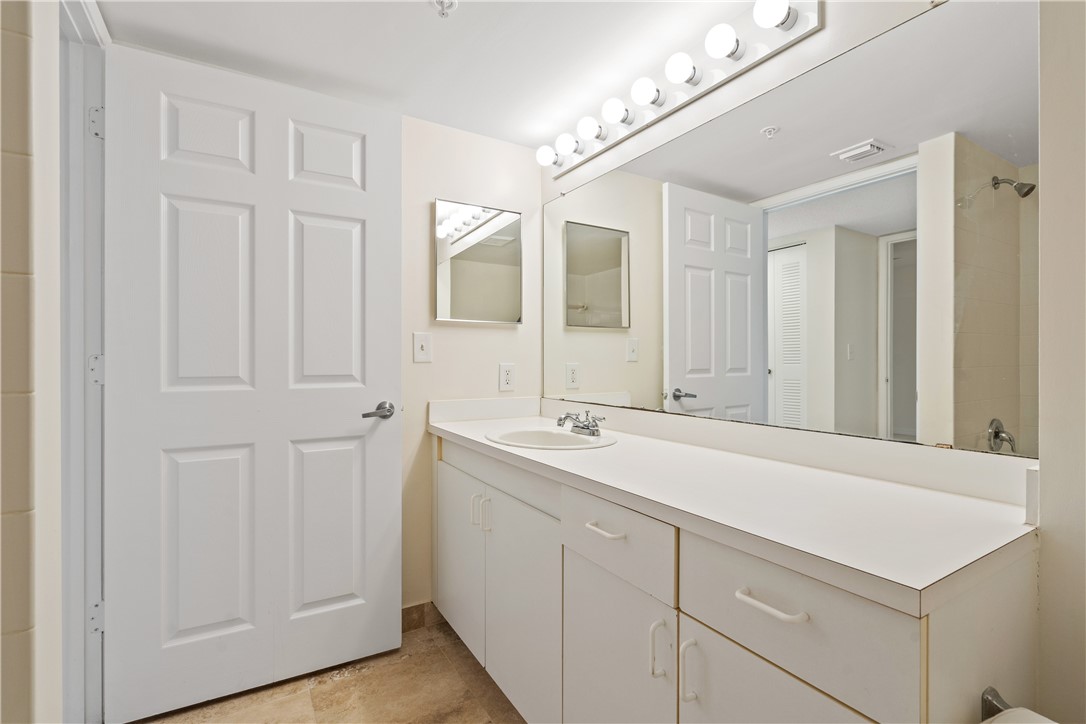 Undisclosed Address Vero Beach, FL 32967 - Photo 26 of 36 a bathroom with a sink and mirror