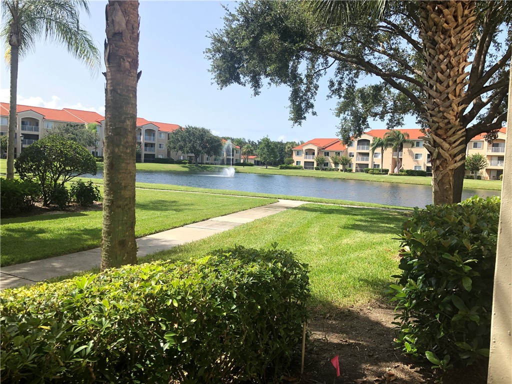 Undisclosed Address Vero Beach, FL 32967 - Photo 4 of 36 a view of a lake with a house