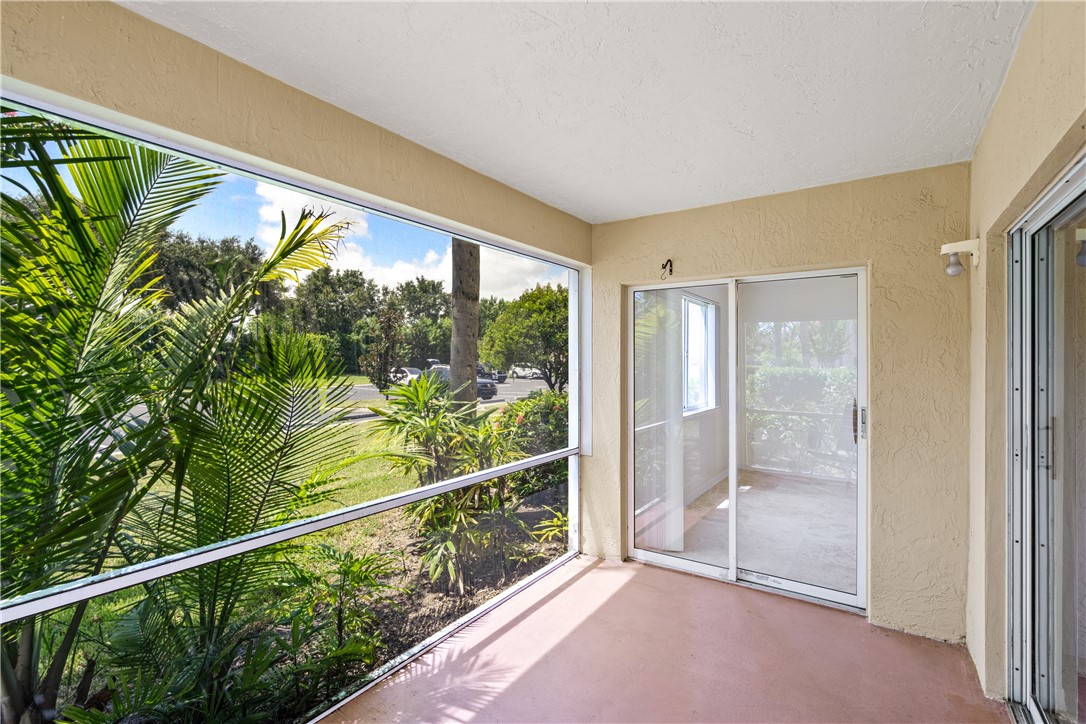 Undisclosed Address Vero Beach, FL 32967 - Photo 6 of 36 a view of a glass door and the balcony