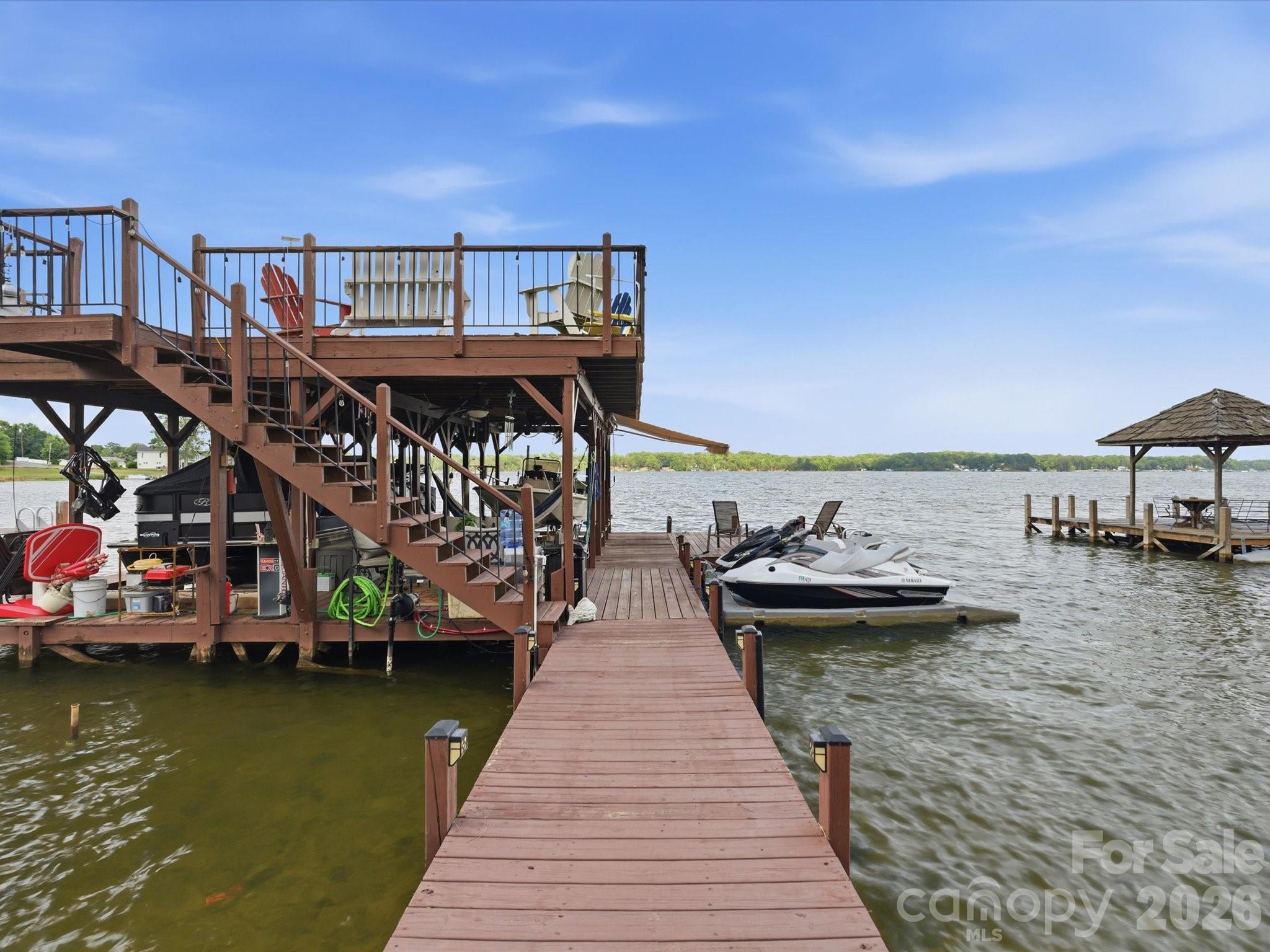 562 Lake Head Road Norwood, NC 28128 - Photo 36 of 43 a view of a lake with roof deck