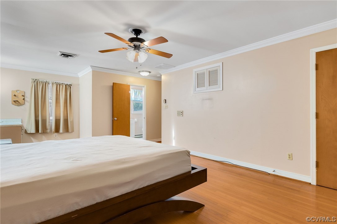 3111 Mountclair Road Chester, VA 23831 - Photo 28 of 42 a bedroom with a bed and wooden floor