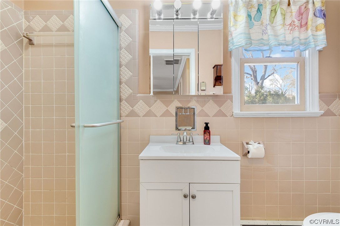 3111 Mountclair Road Chester, VA 23831 - Photo 29 of 42 a bathroom with a sink vanity and mirror