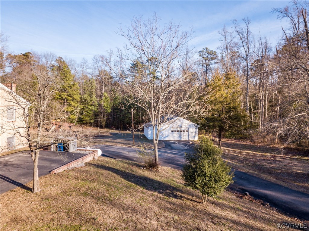 3111 Mountclair Road Chester, VA 23831 - Photo 4 of 42 a view of a yard with plants and trees