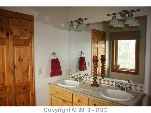 198 Joshua Road Divide, CO 80814 - Photo 17 of 25 Adjoining Master Bath with Double Vanity, Shower and Walk-in Closet