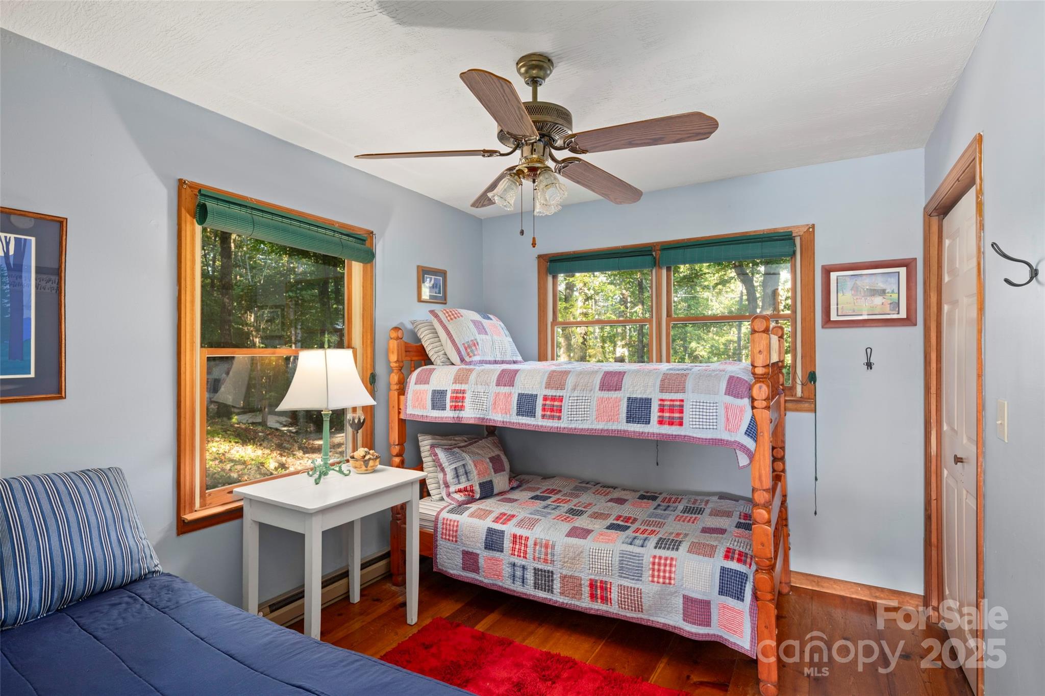 31 Piney Rdg Lane, Unit 27 Saluda, NC 28773 - Photo 21 of 36 a bedroom with a bed and wooden floor