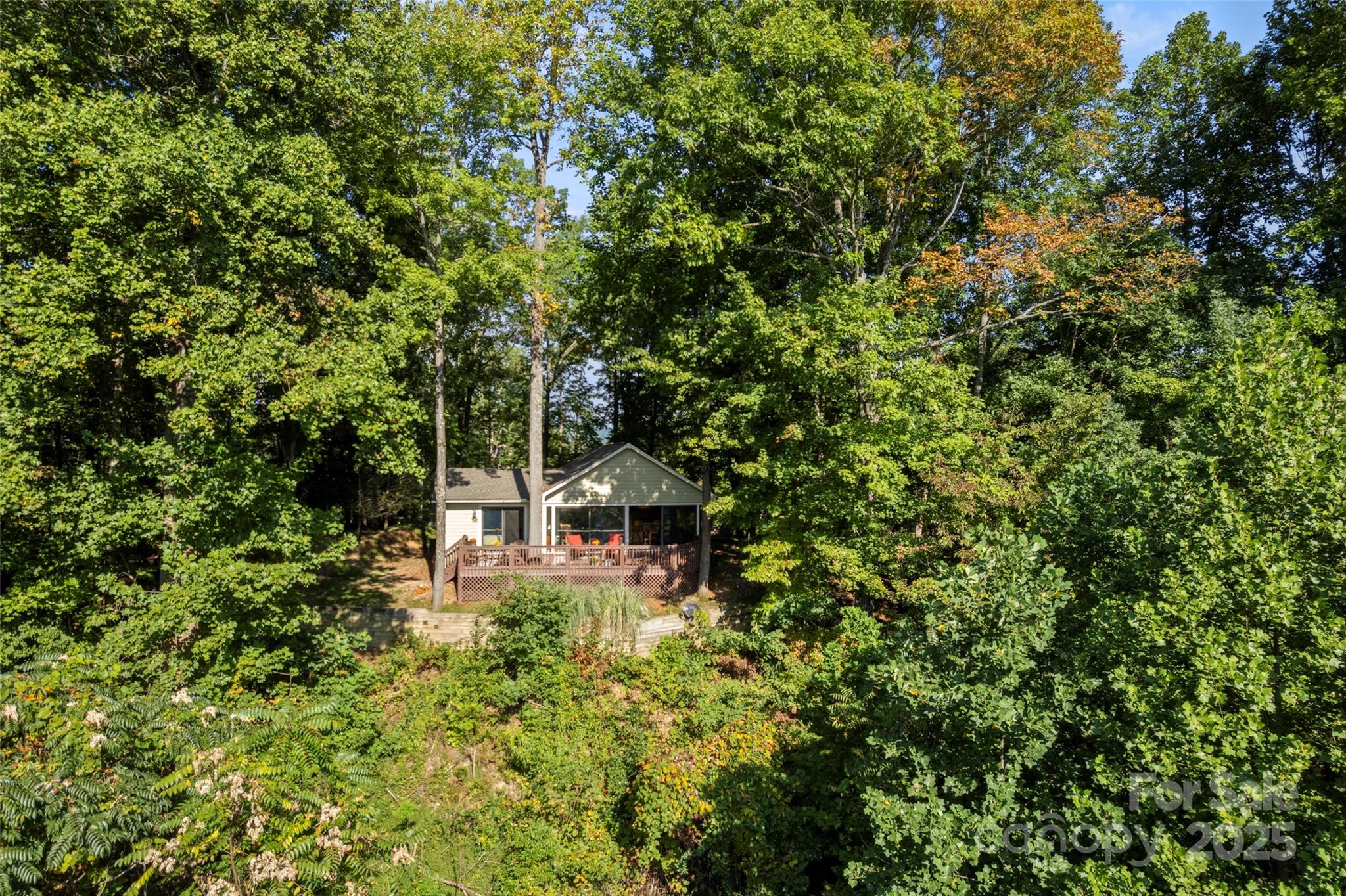 31 Piney Rdg Lane, Unit 27 Saluda, NC 28773 - Photo 26 of 36 a view of a house with a tree