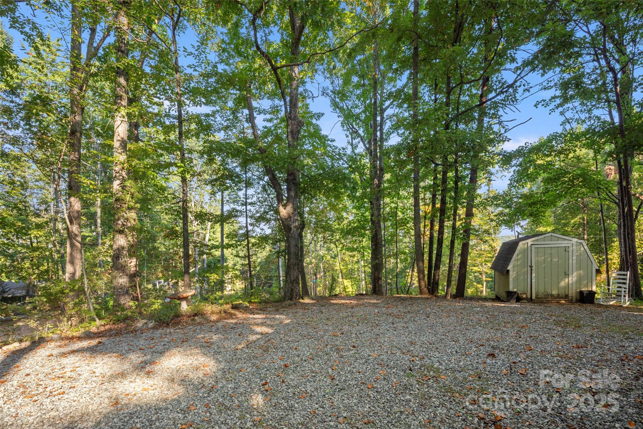 31 Piney Rdg Lane, Unit 27 Saluda, NC 28773 - Photo 29 of 36 a view of a backyard with large trees