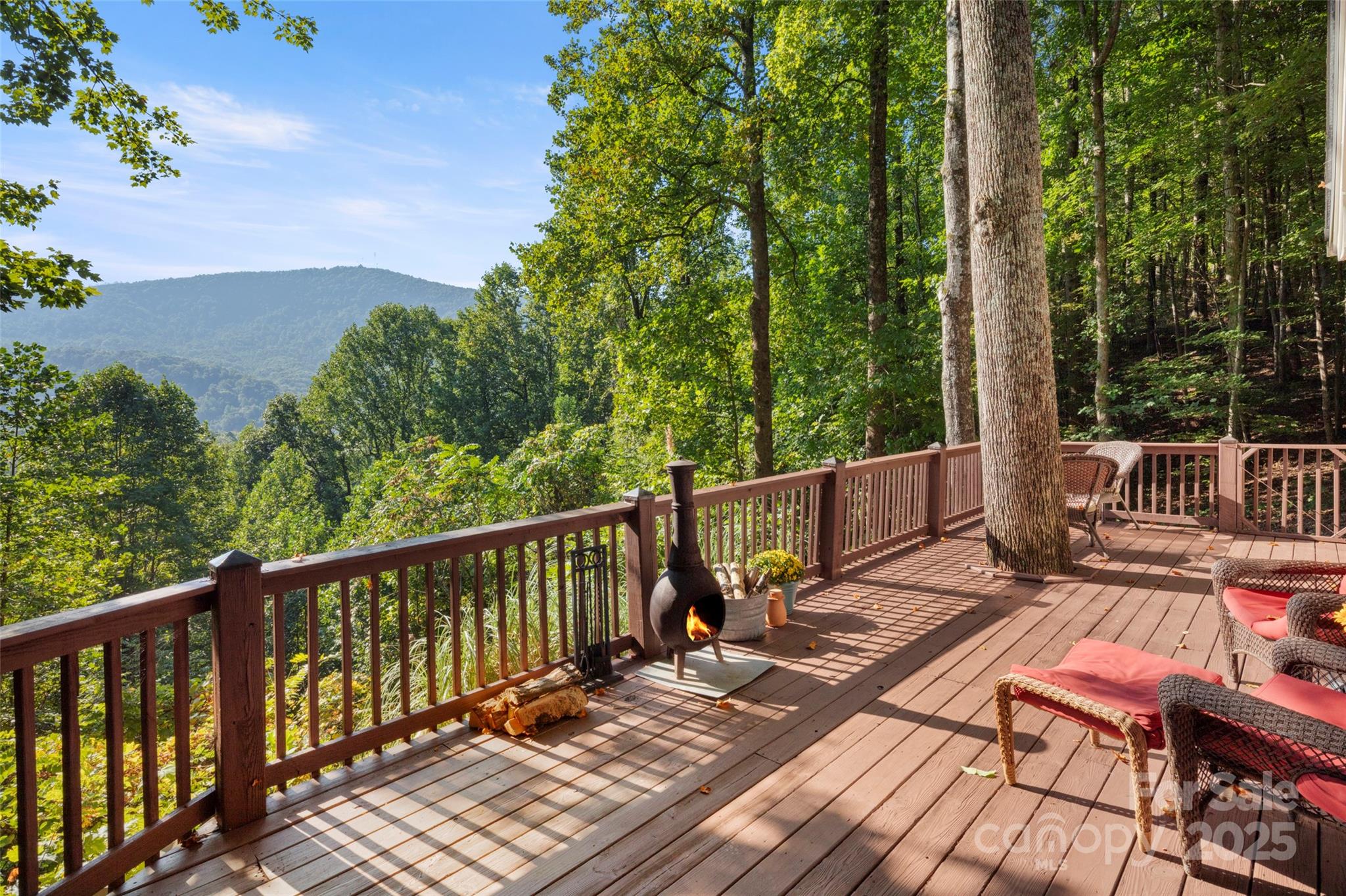 31 Piney Rdg Lane, Unit 27 Saluda, NC 28773 - Photo 4 of 36 a view of a wooden deck with a bench